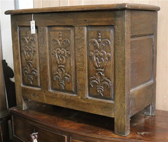 An early 18th century oak coffer, with later carving W.79cm